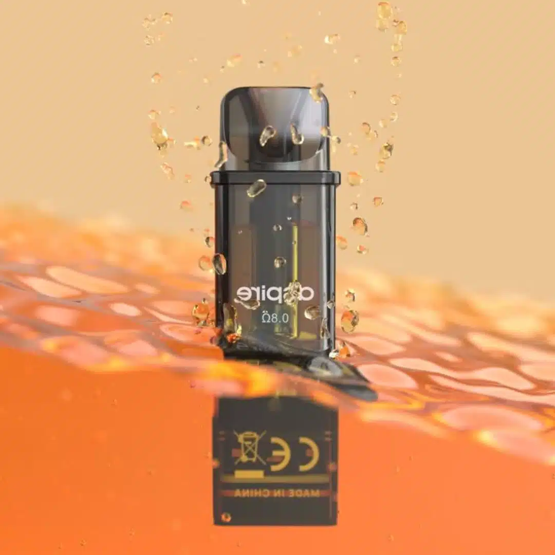 An Aspire Gotek X Replacement Pod is shown with an e-liquid bottle filling it through a side port with an orange silicon stopper. The pod is transparent with a black frame, revealing the internal coil and e-liquid level. The bottom has gold and silver contact points for device connection.