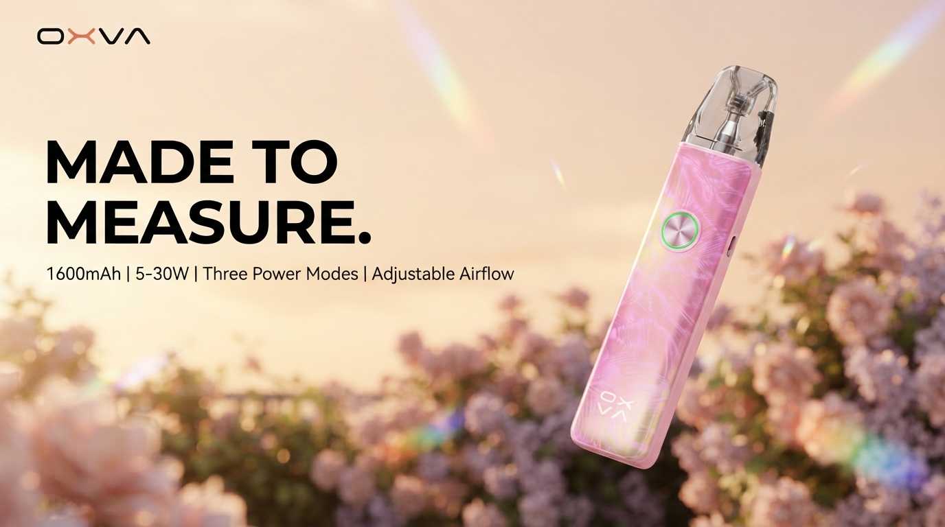 OXVA Xlim 4 Pod Kit in Aurora Petal Pink among blossoms at golden hour
